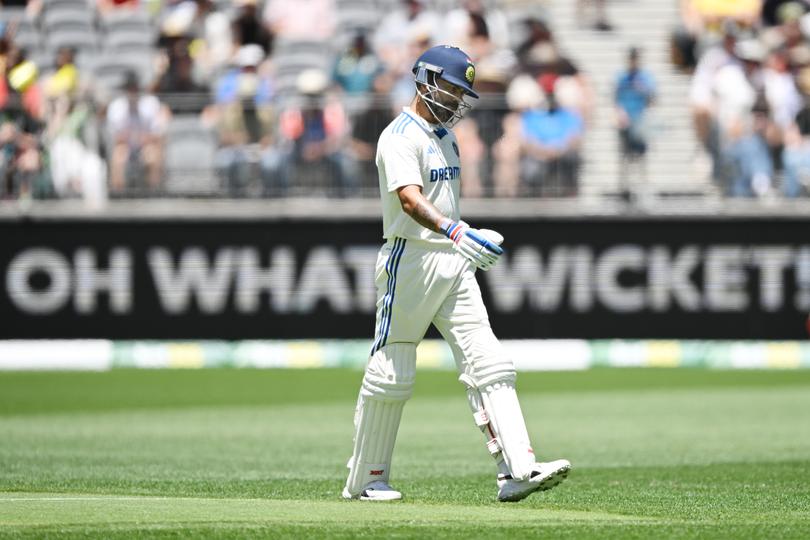 Kohli walking off.