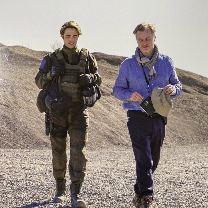 Robert Pattinson and Christopher Nolan on the set of Tenet.