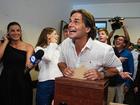 Uruguayan President Luis Lacalle Pou (C) casts his vote at a polling station during the second round of the presidential elections in Canelones, Uruguay.