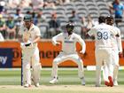 Travis Head walks off the field after being dismissed by Jasprit Bumrah.