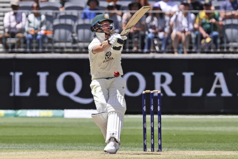 Australia's Steve Smith is hit in the stomach by a ball from India's Harshit Rana on the fourth day of the first cricket test between Australia and India in Perth, Australia, Monday, Nov. 25, 2024. (AP Photo/Trevor Collens)