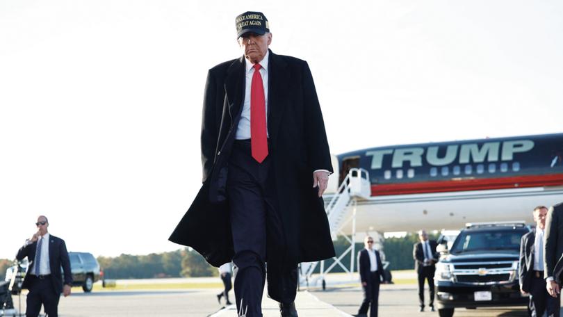 Donald Trump arrives for a campaign rally at Kinston Regional Jetport on November 03, 2024 in Kinston, North Carolina. 