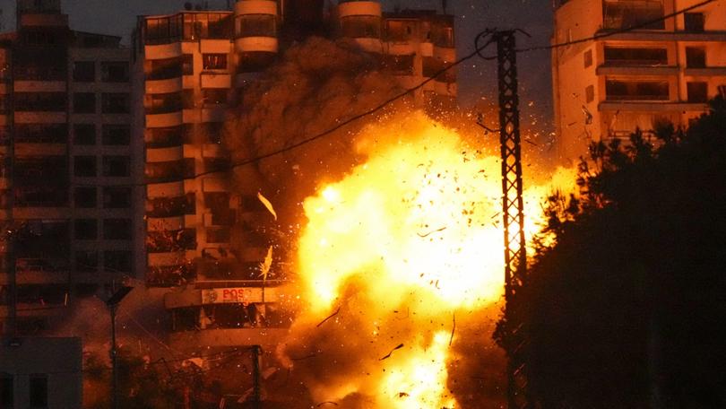 Thick smoke and flames erupt from an Israeli airstrike in Tayouneh, Beirut, Lebanon, Monday, Nov. 25, 2024. (AP Photo/Hassan Ammar)