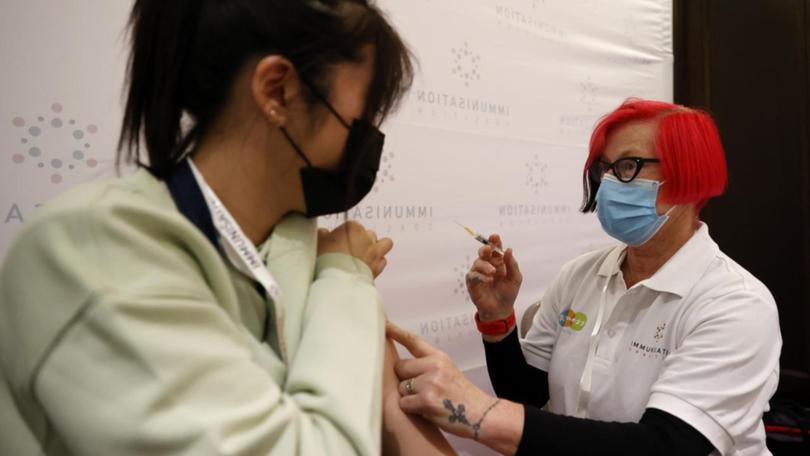 A woman is vaccinated (file image)