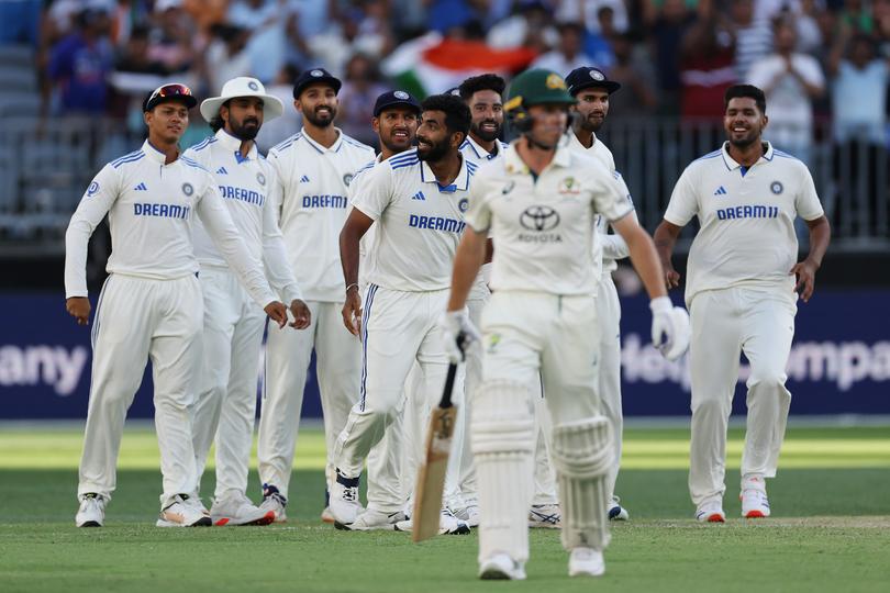 PERTH, AUSTRALIA - NOVEMBER 24: Jasprit Bumrah of India celebrates with team mates after taking the wicket of Nathan McSweeney of Australia for a duck during day three of the First Test match in the series between Australia and India at Perth Stadium on November 24, 2024 in Perth, Australia. (Photo by Cameron Spencer/Getty Images)