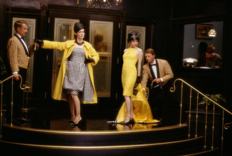 The yellow and black-and-white houndstooth double ensemble reveal in Down With Love.