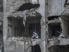 A woman inside a building that was damaged by an Israeli strike in Beirut, the Lebanese capital, on Saturday, Nov. 23, 2024. 