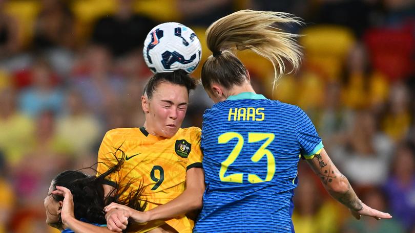 BRISBANE, AUSTRALIA - NOVEMBER 28: Caitlin Foord of Australia competes for the ball against Isadora Haas Gehlen of Brazil during the International Friendly match between the Matildas and Brazil at Suncorp Stadium on November 28, 2024 in Brisbane, Australia. (Photo by Albert Perez/Getty Images)