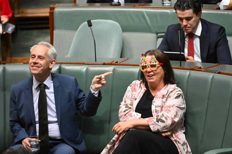 Australian Resources Minister Madeleine King in the silly season mode during divisions in the House of Representatives at Parliament House in Canberra on Friday.