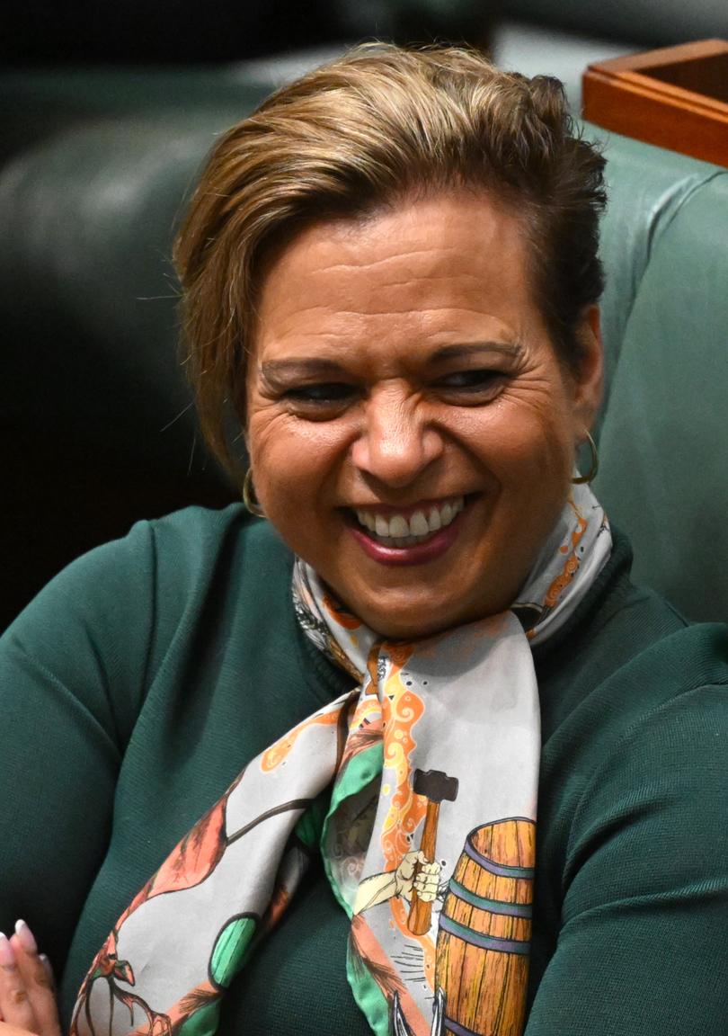 Australian Communications Minister Michelle Rowland reacts during divisions in the House of Representatives.