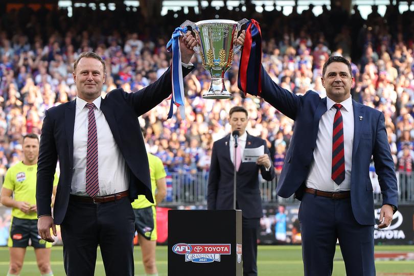 Grant (left) with the premiership cup ahead of the 2021 decider. 