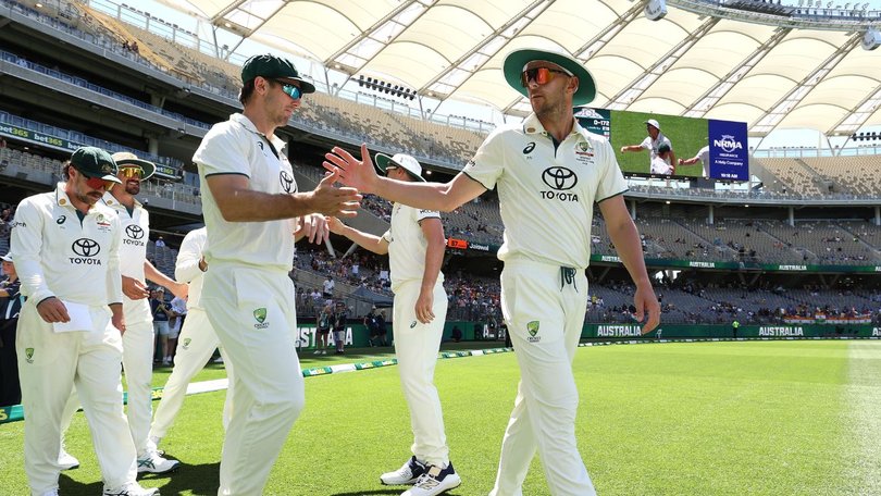 Mitch Marsh and Josh Hazlewood during the first Test in Perth.