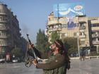 Rebel fighters have gathered in Aleppo's central square after storming the northwestern Syrian city. 