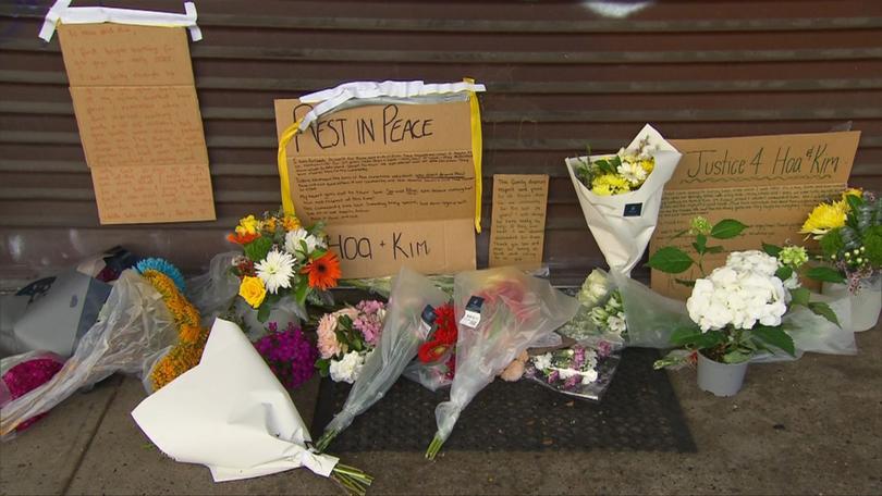 A mourning community has left tributes for the slain couple outside their takeaway shop at Cambridge Park.