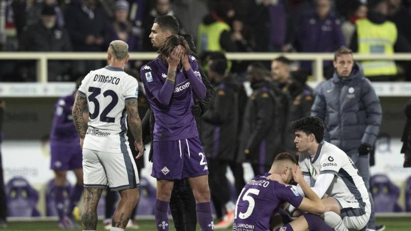 Emotional Fiorentina and Inter players comfort each other after Edoardo Bove's collapse on the pitch.