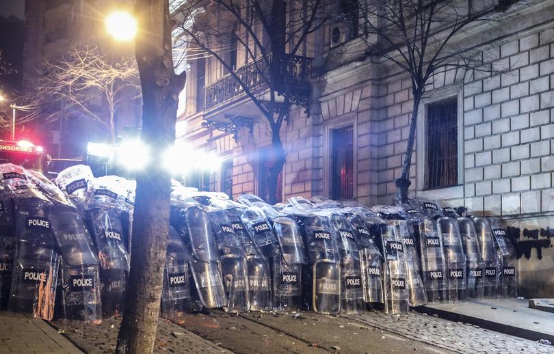 Police block a street during the protest of Georgian opposition supporters in front of the Parliament building in Tbilisi, Georgia.