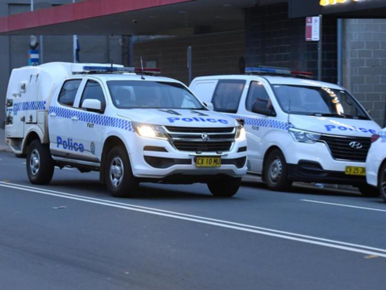 A man has been charged with performing a Nazi salute in front of marchers in Sydney's inner west.