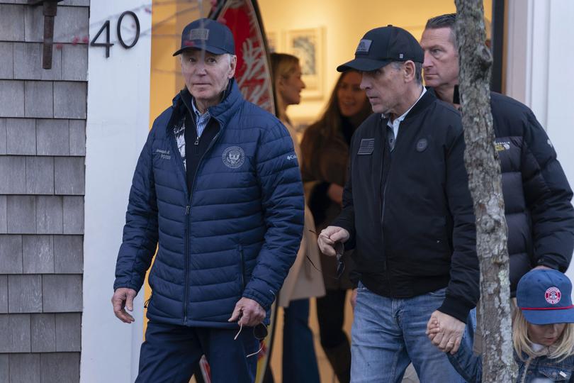 President Joe Biden and his son Hunter Biden walk in downtown Nantucket., Friday, Nov. 29, 2024. 