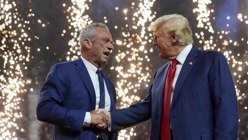 Donald Trump shakes hands with Robert F. Kennedy Jr. at an Arizona campaign rally.