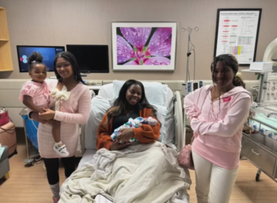Sondra Williams smiles with her children.