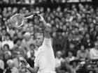 Neale Fraser playing at Wimbledon.