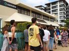 Australians line up outside a Centrelink service centre. File image.