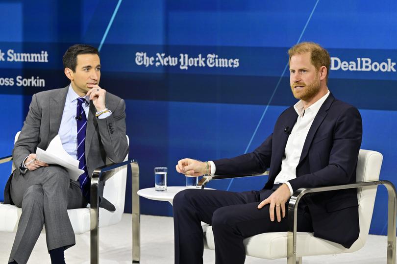 Andrew Ross Sorkin and Prince Harry, Duke of Sussex, speak onstage.