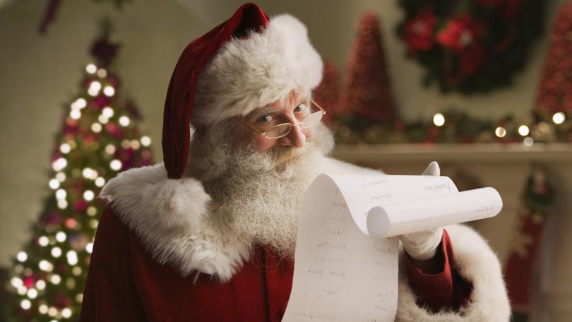 Santa Claus with checklist, portrait, close-up