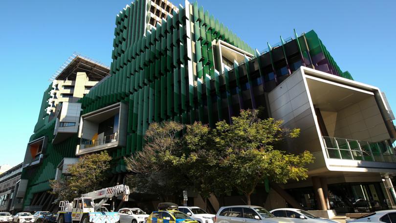 A man has been left fighting for life and three children rushed to hospital in a car rollover in Brisbane’s north. 