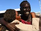 Gout Gout and his mother embrace at the track during the Australian All Schools Championships.