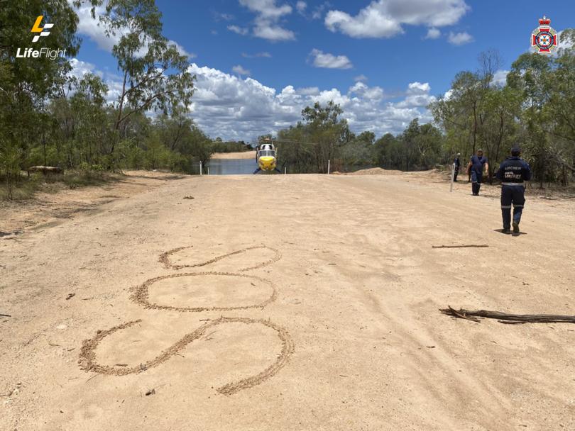 The couple were spotted after etching SOS in the ground.