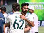 Australian Travis Head and Mohammed Siraj of India shake hands.