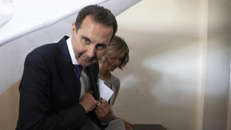 Syrian President Bashar al-Assad, pictured with his wife Asma, has reportedly fled the country.