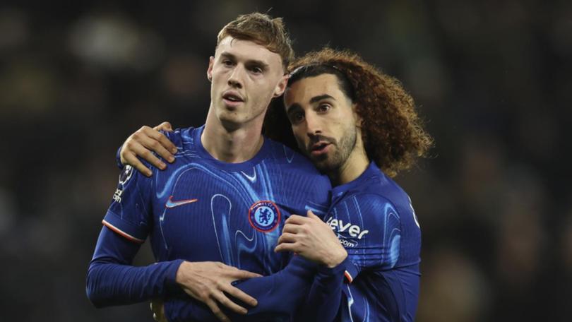 Chelsea's two-goal Cole Palmer celebrates with teammate Marc Cucurella in the win over Spurs.