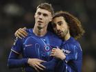 Chelsea's two-goal Cole Palmer celebrates with teammate Marc Cucurella in the win over Spurs.