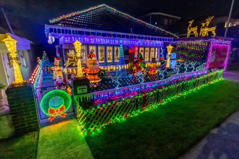 Stand out on the street of this 5 Waratah Street, North Bondi home to take in the display of Christmas lights hanging from the house, filling the front yard and decorating the garage.