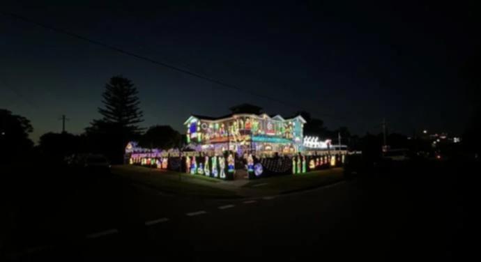 Stand out on the street of this 5 Waratah Street, North Bondi home to take in the display of Christmas lights hanging from the house, filling the front yard and decorating the garage.