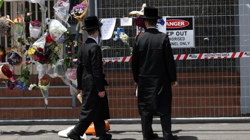 The attack on a synagogue was declared a likely terror strike with three suspects wanted by police (Con Chronis/AAP PHOTOS)