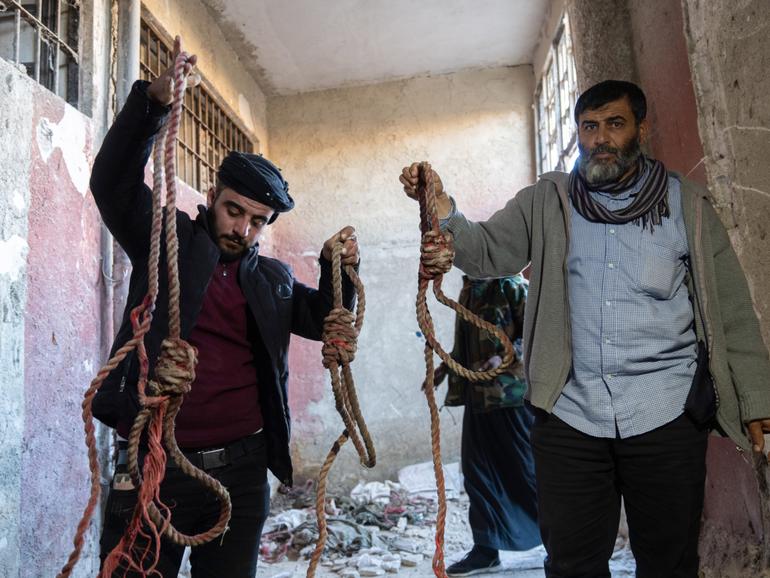 DAMASCUS, SYRIA - DECEMBER 9: People are seen at the Sednaya Military Prison after armed groups, opposing Syria's Bashar al-Assad regime take control in Damascus, Syria on December 9, 2024. (Photo by Emin Sansar/Anadolu via Getty Images) Anadolu