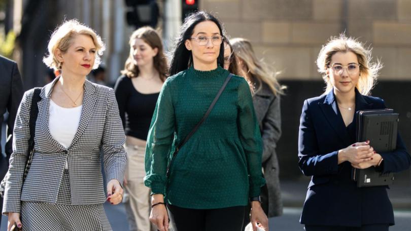 Patrice Turner (centre) led the class action claiming women suffered harm from the Essure device.