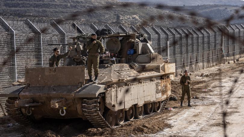 Israeli soldiers on Monday along the border fence with Syria near the Druze village of Majdal Shams in the occupied Golan Heights. 