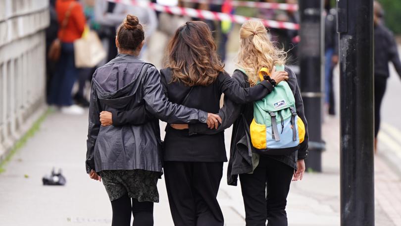 People at the scene where 15-year-old Elianne Andam was stabbed to death.