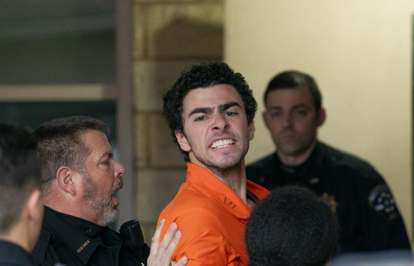 Suspect Luigi Mangione is taken into the court. (Benjamin B. Braun/Pittsburgh Post-Gazette via AP)