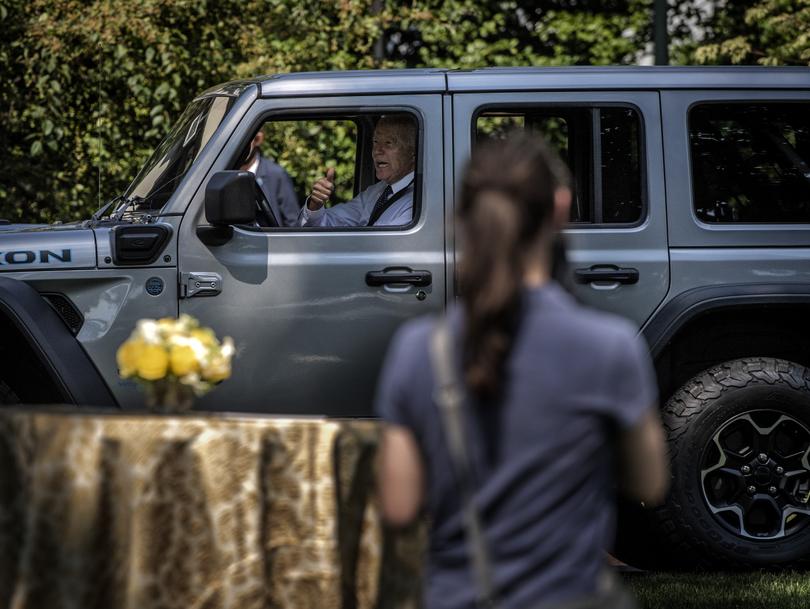 President Joe Biden takes an electric vehicle for a spin around the South Lawn of the White House in Washington, D.C. 