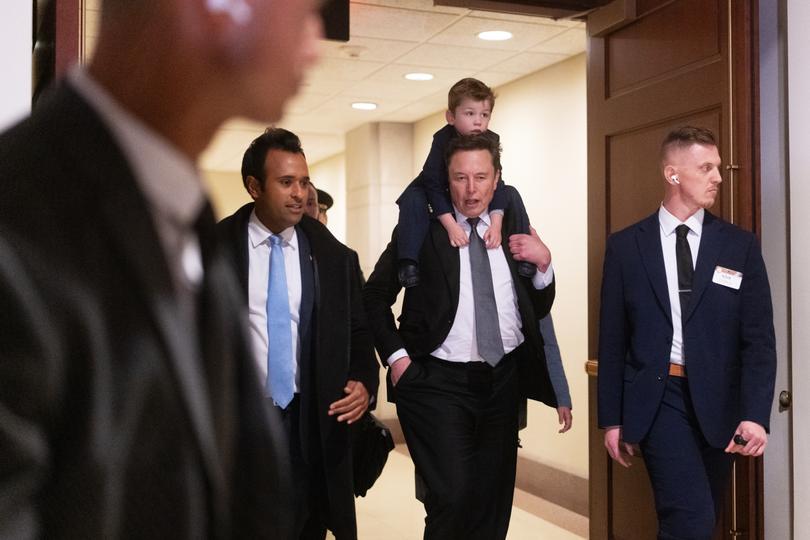 Vivek Ramaswamy and Elon Musk, with his son X, depart the Capitol building in Washington, D.C. on December 5. 