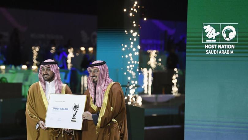 Saudi minister Abdulaziz bin Turki al-Faisal al-Saud (L) and football president Yasser Al Misehal.