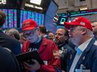 Traders watch as President-elect Donald Trump walks onto the floor of the New York Stock Exchange.