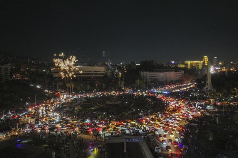 Fireworks exploded over Umayyad Square as celebrations continued into the night following the first Friday prayers since Bashar Assad's ousting. 