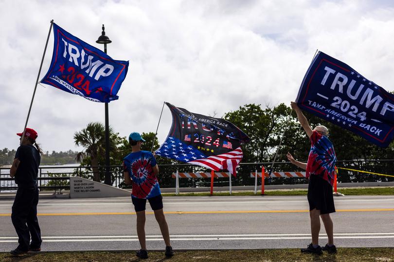 Supporters of Donald Trump celebrate his presidential election victory outside his Mar-a-Lago estate in Palm Beach, Florida, on Nov. 6. MUST CREDIT: Saul Martinez for The Washington Post