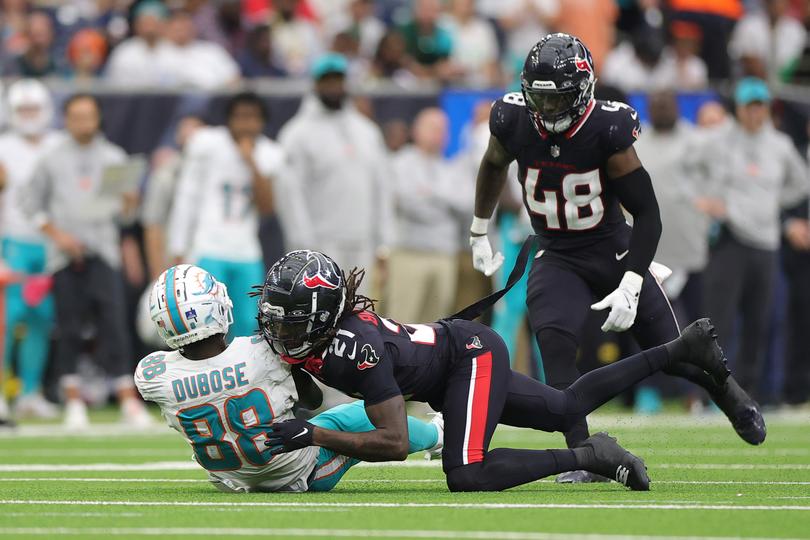 Dolphin Grant DuBose Miami Dolphins is hit by Calen Bullock of the Houston Texans.